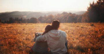 man-and-woman-sitting-on-grass.jpg man and woman sitting on grass